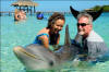 Kathy, Baily & Bob with a big Dolphin hug!
