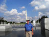 Bob at the WWII Memorial with the Washington Monument in the background